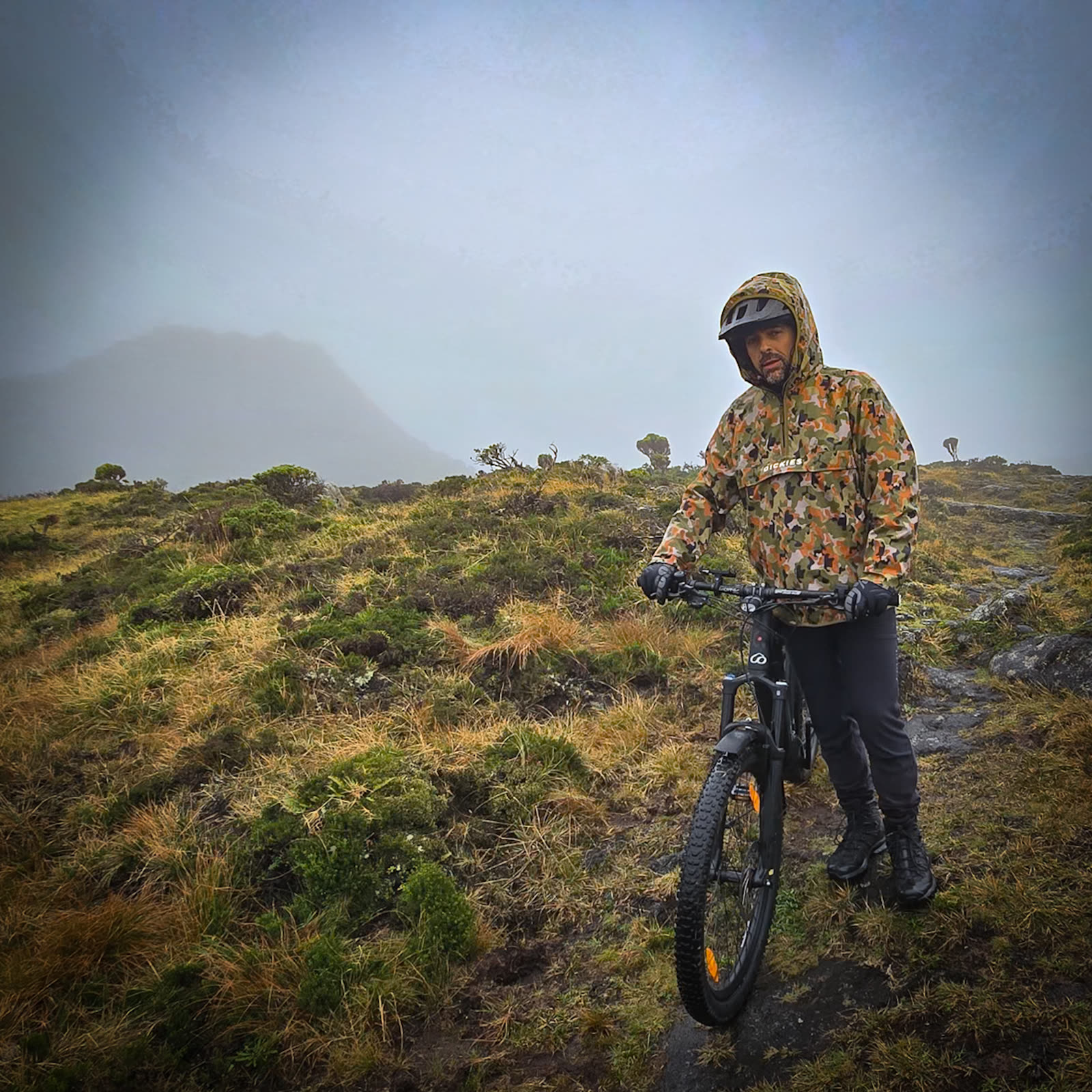 Rider in a camo jacket and helmet with the BEEQ, in the fog