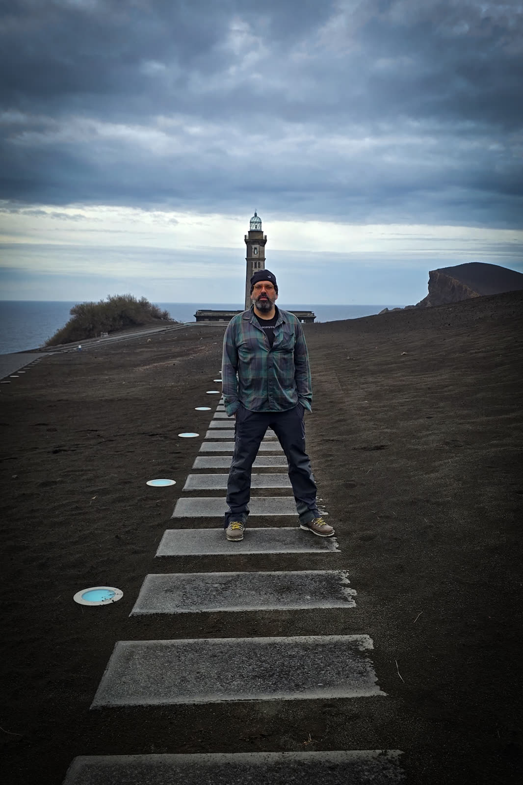 José on the volcanic ash walkway by the Capelinhos Lighthouse