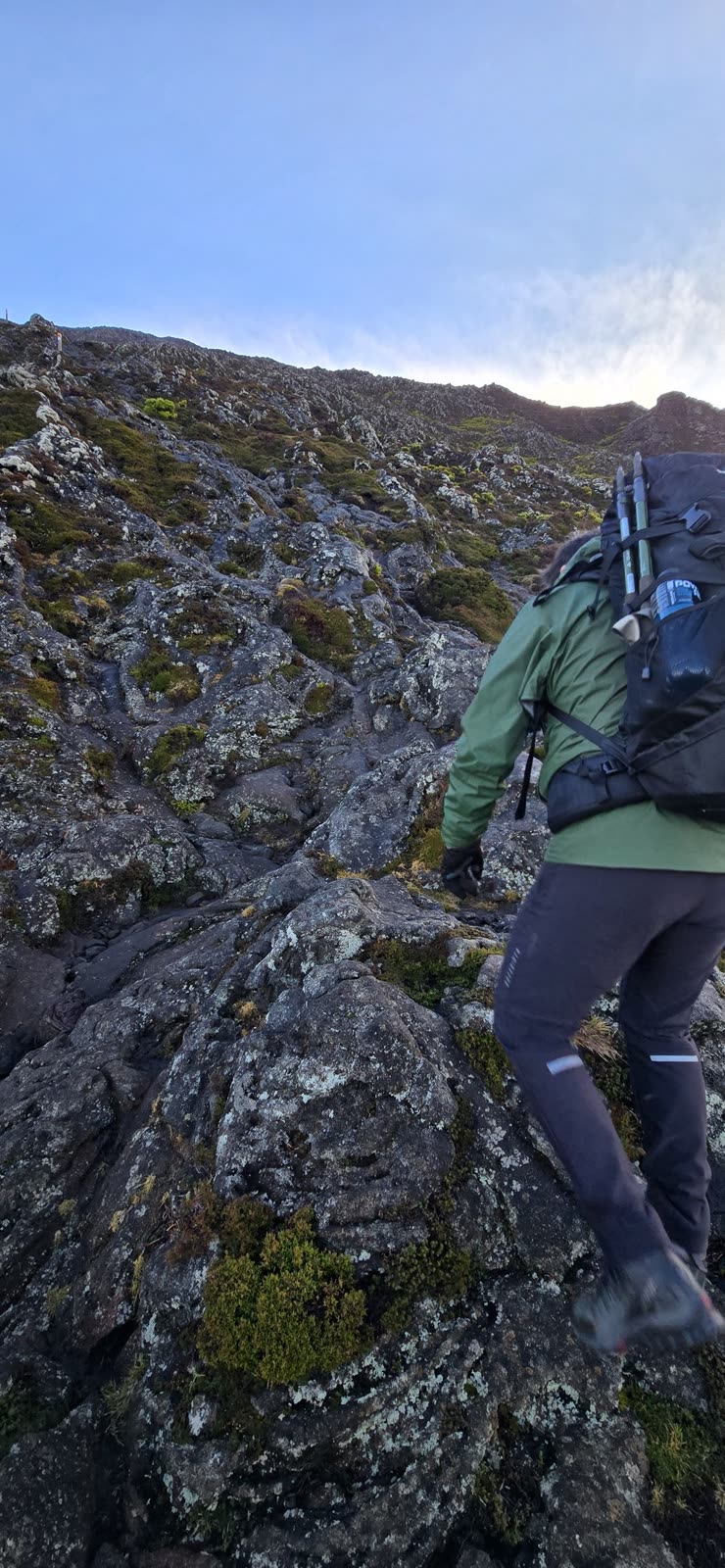Climbing the moss-covered lava slope